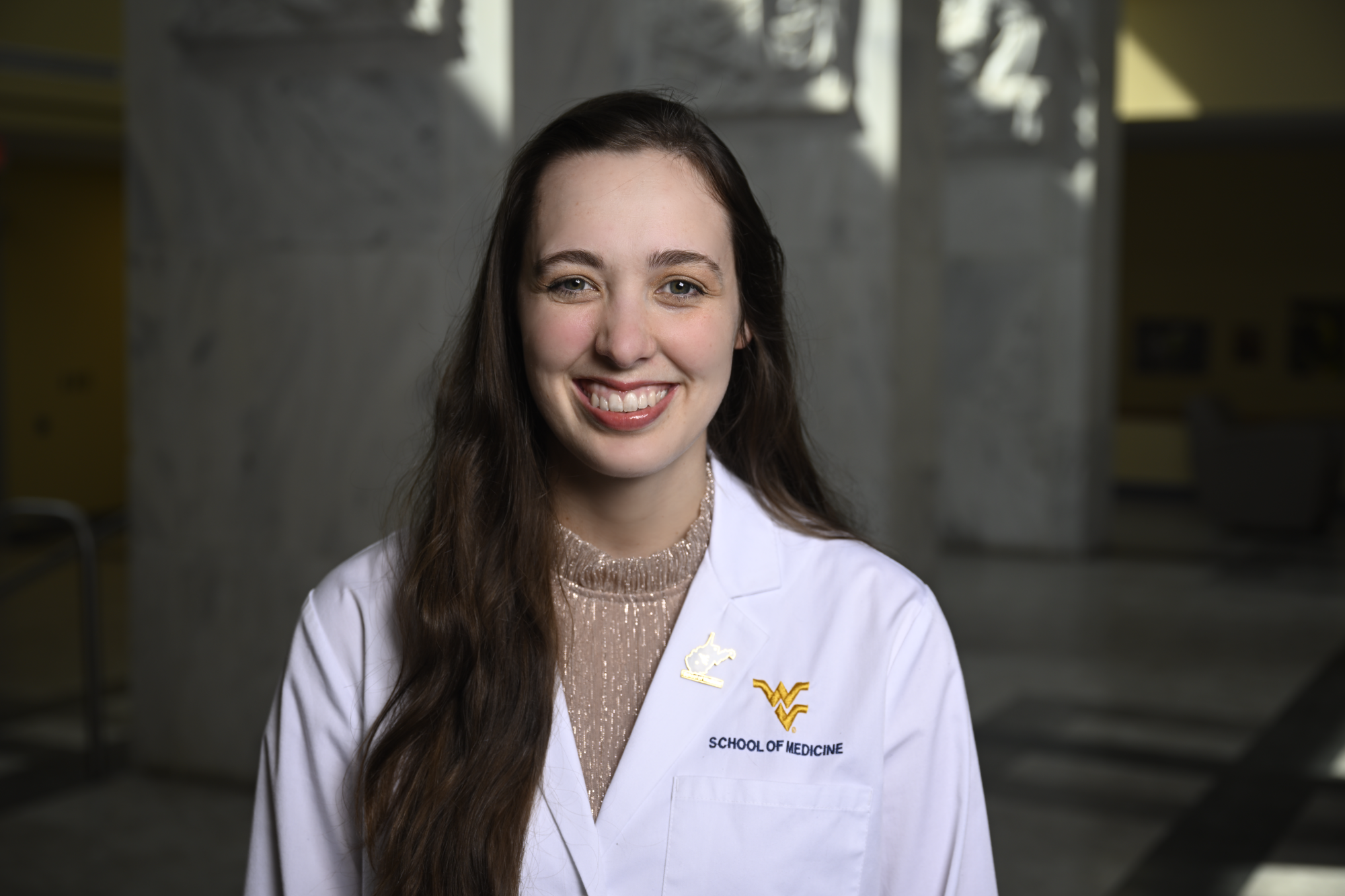 headshot_echoscholarship_anna_1 Anna smiles in her white doctor's coat